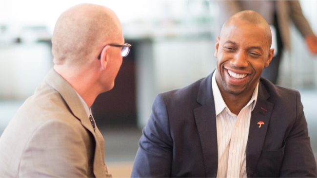 An engaging one-on-one conversation between an insurance broker and business owner.