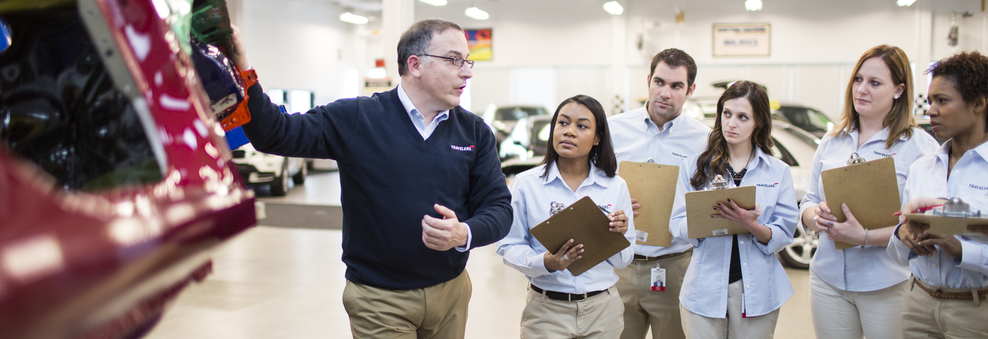 Travelers’ employees listen to an instructor at Travelers Claim University.