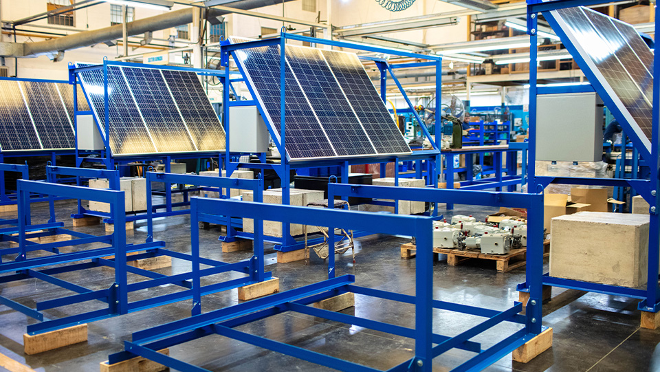 Solar panels on shop floor in industrial warehouse.