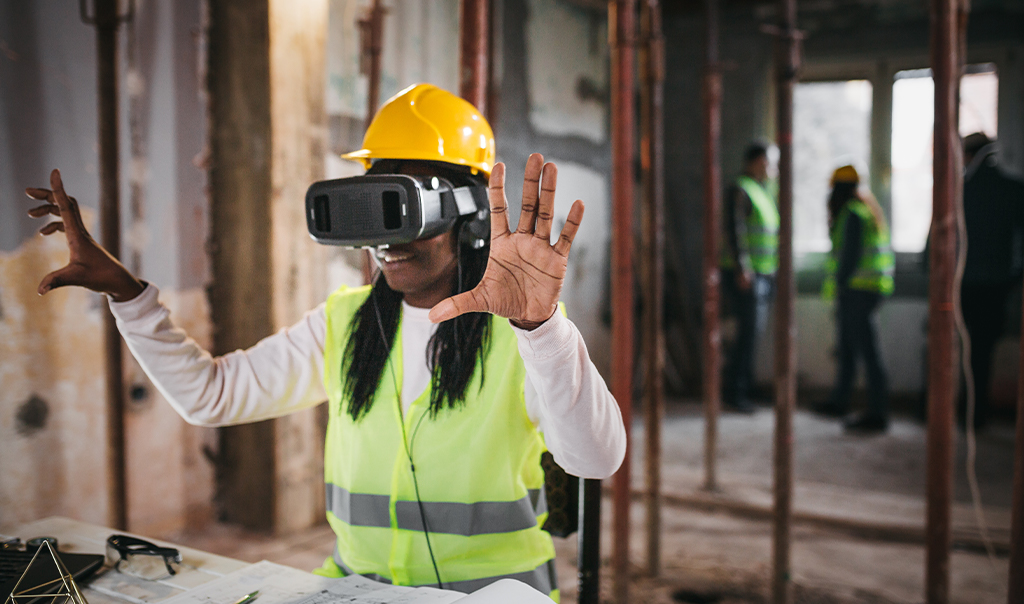 construction worker wearing virtual reality glasses.