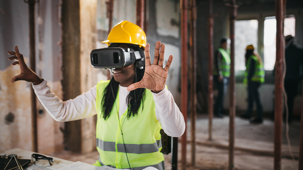 Woman in construction using virtual reality technology to improve safety on the job site.