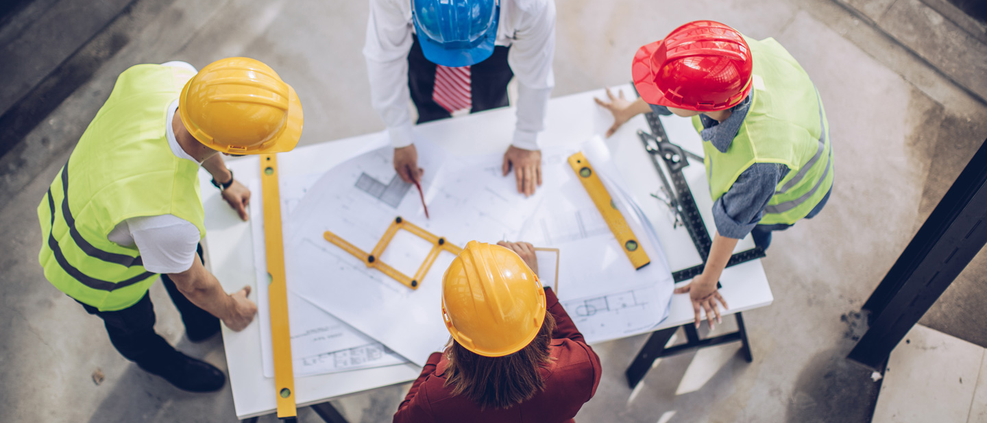 Architects working together at construction site