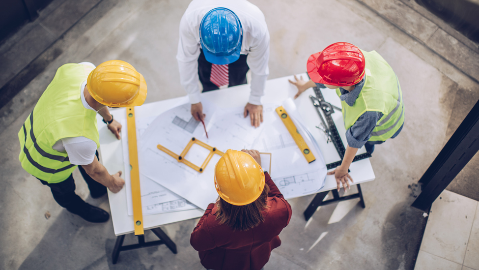 Architects working together at construction site