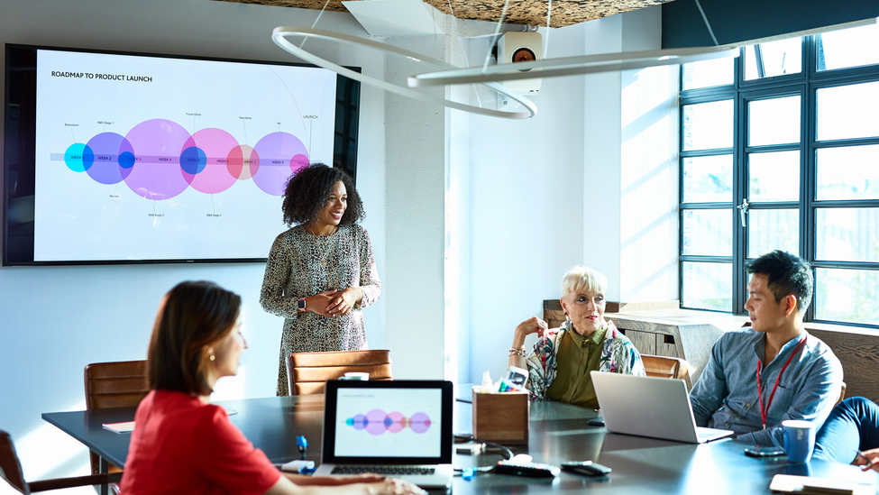 businesswoman heading meeting in board room