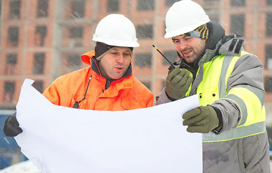 Workers discussing in Cold weather 