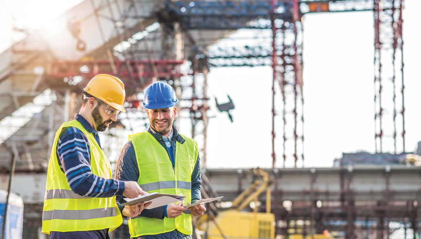 Construction professionals discussing jobsite safety.