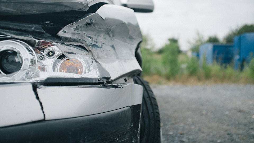 Front of car damaged after a wreck.