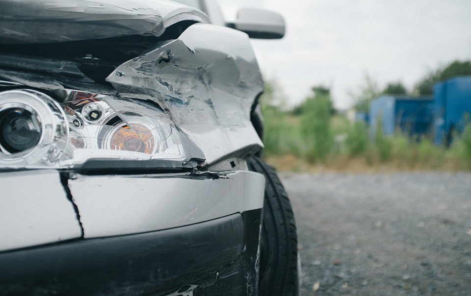 Front of car damaged after a wreck.