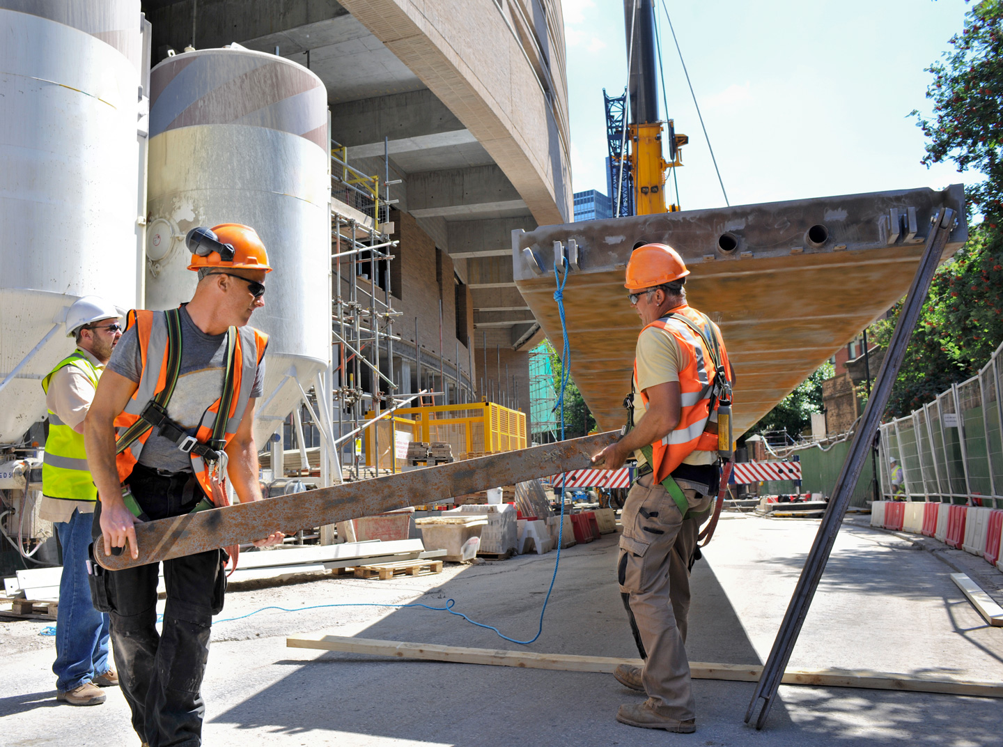 A group of construction workers are working on a construction site.