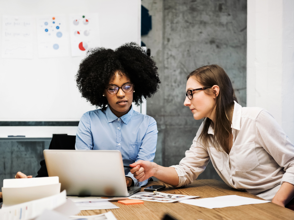 Two executives working together at a conference table