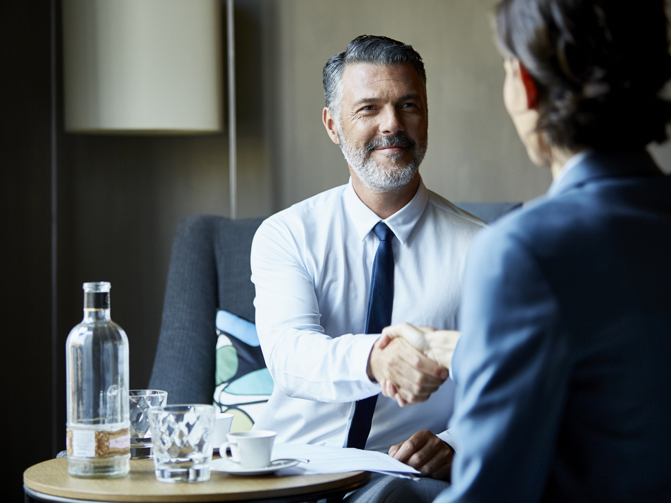 Business people shaking hands after successful business meeting