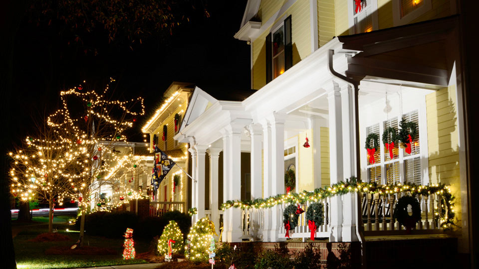 House at night decorated for the holidays