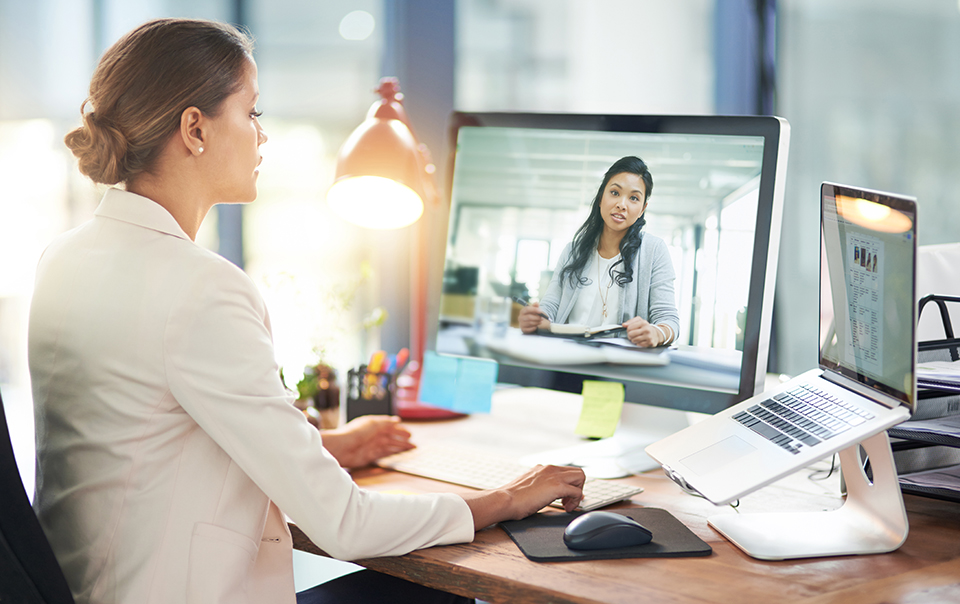 Two women virtually conferencing