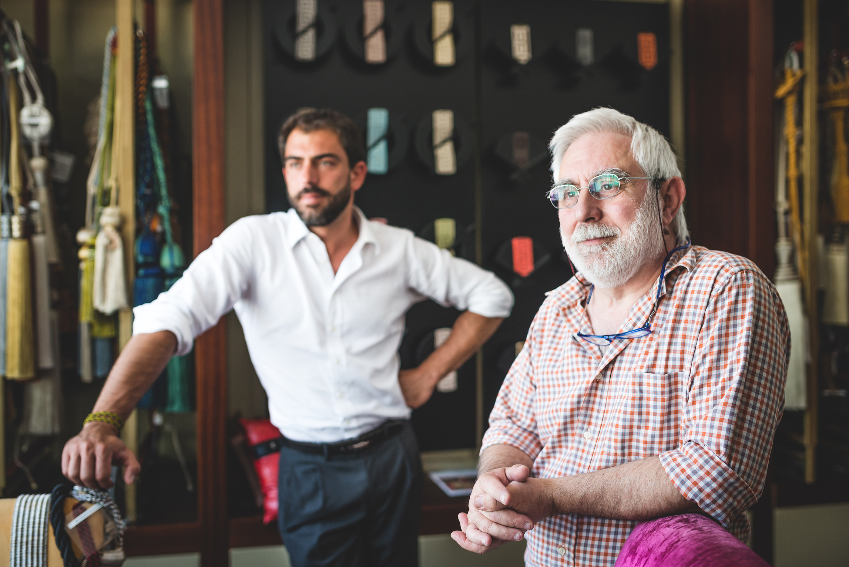 Mature man with his son in their factory