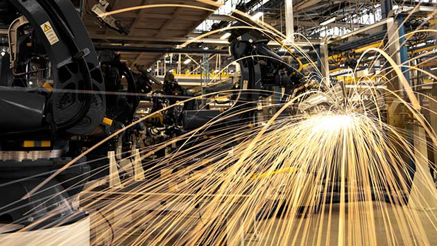 sparks from manufacturing equipment in a factory