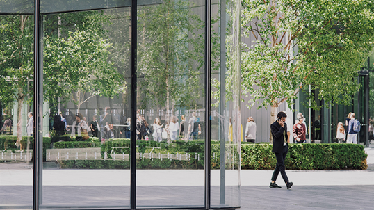 A businessperson takes a call outside.