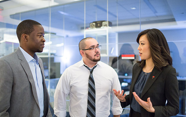 Three professional insurance agents having a meeting.