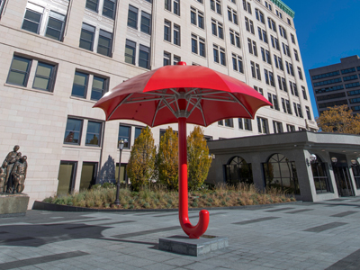 Large red umbrella sculpture outside of the Travelers Tower building.