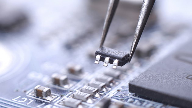 Closeup of computer chip manufacturing.