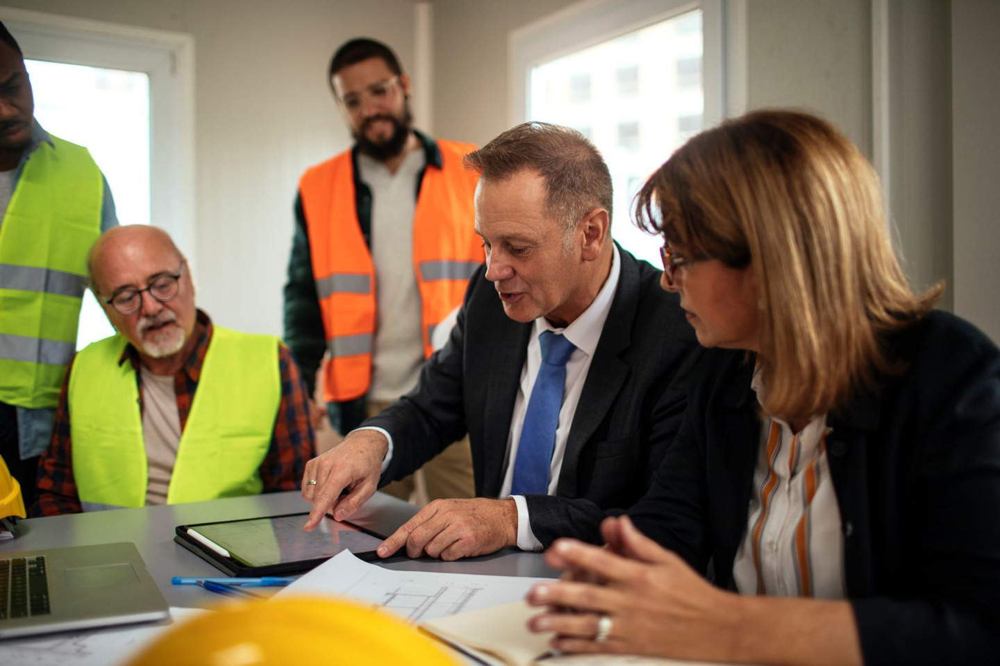 business meeting among a group of men and women