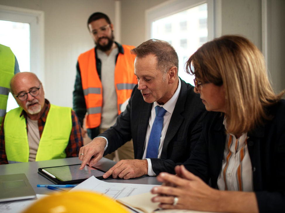 business meeting among a group of men and women