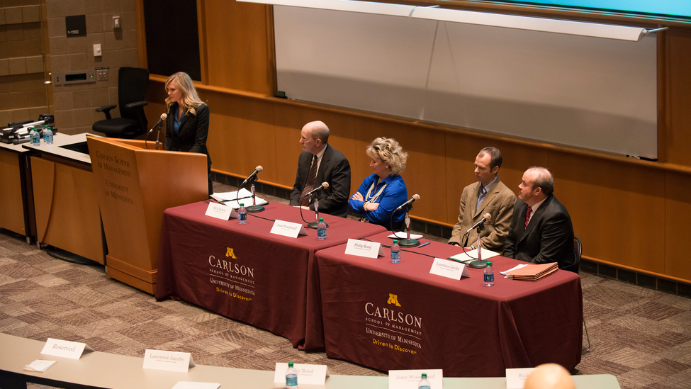 University of Minnesota student Kristin Larson introduces panelists.