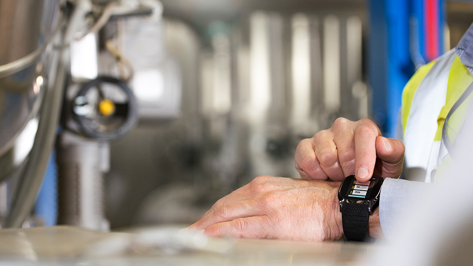 Employee at work wearing smart watch.