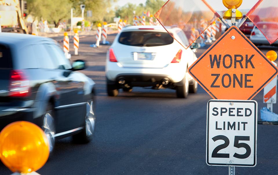 cars driving through a work zone