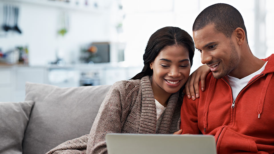 A couple buying a car online.