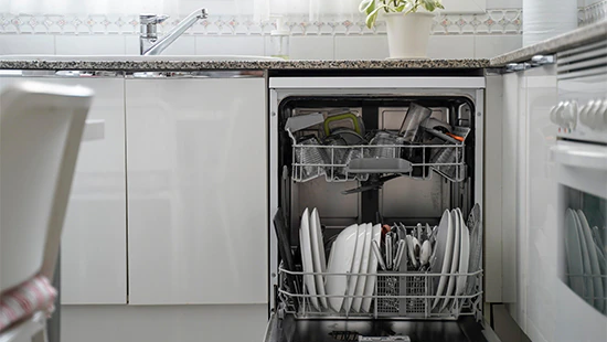 A dishwasher filled with dishes. 