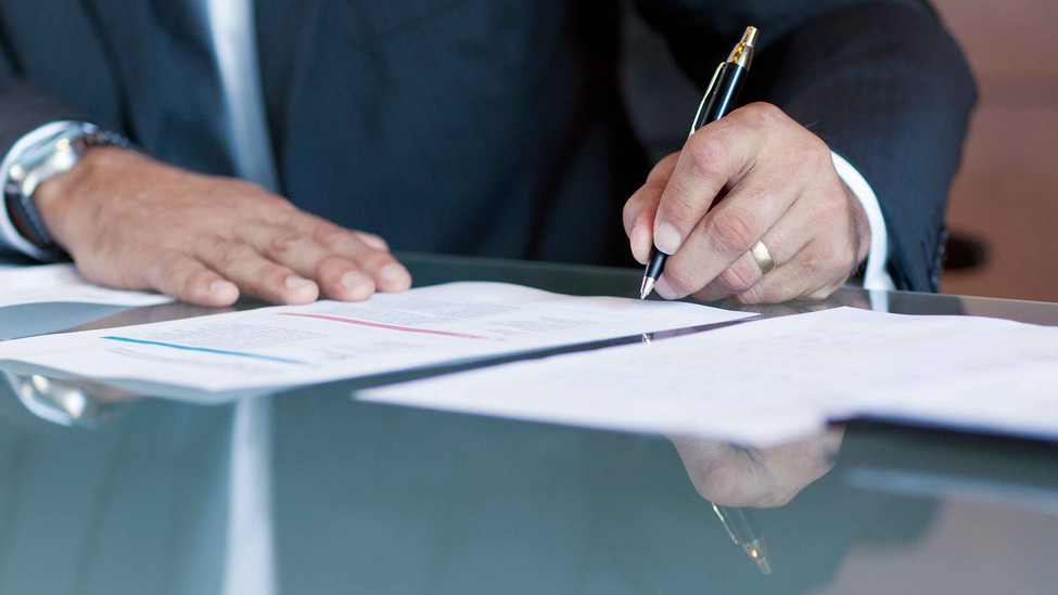 A member of the legal team taking notes during a venue assessment.