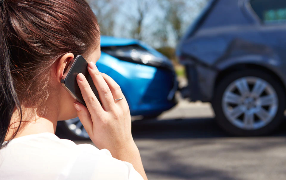 Person calling for help after a car accident.