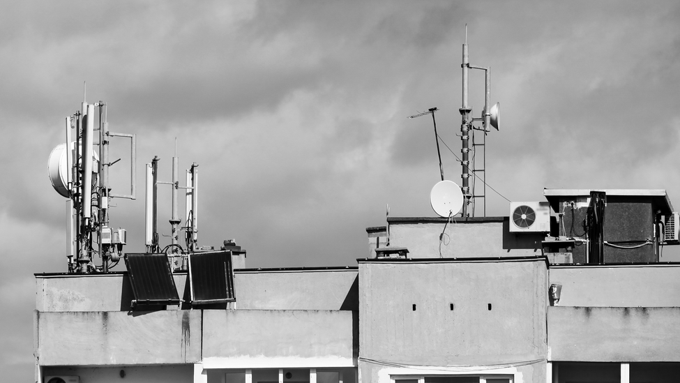 Data-gathering weather antennas sit atop a research building.