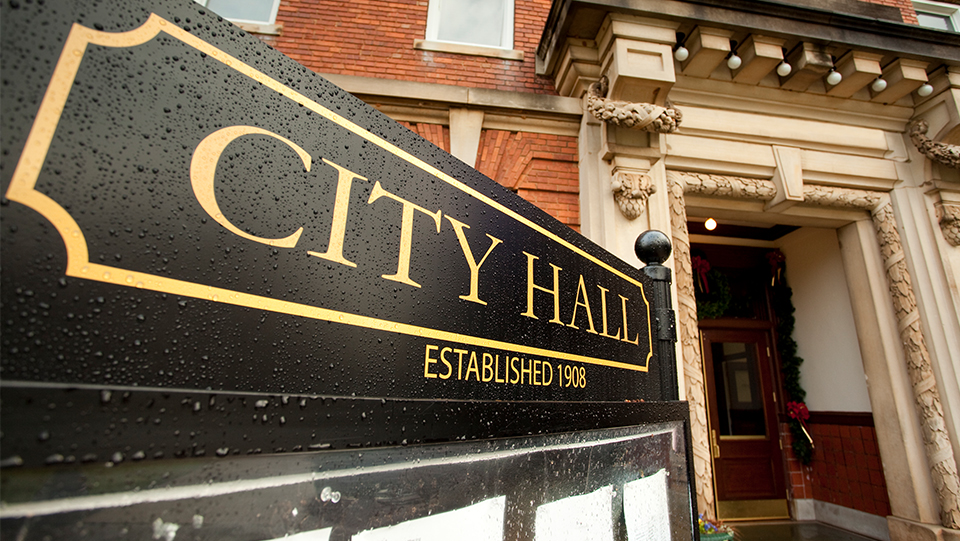 Building with a city hall sign.