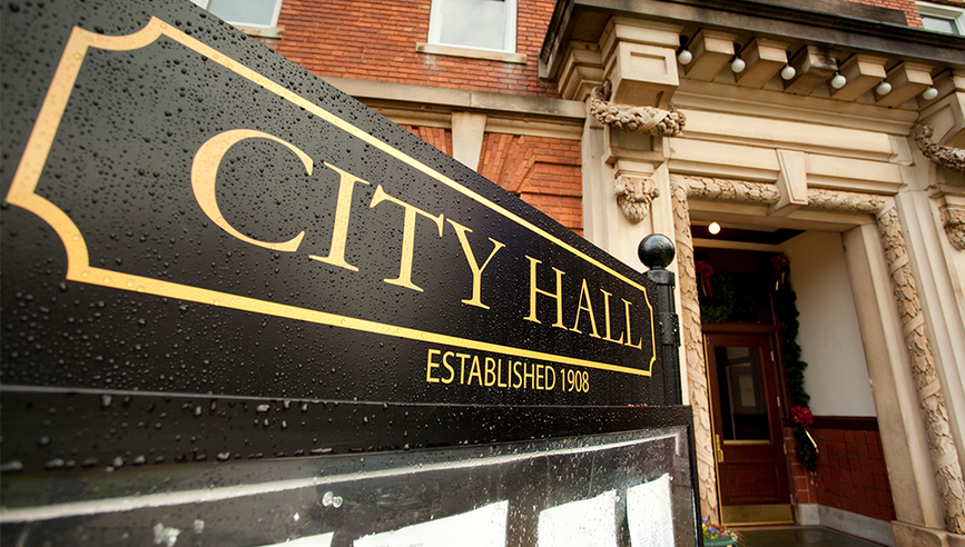 Building with a city hall sign.