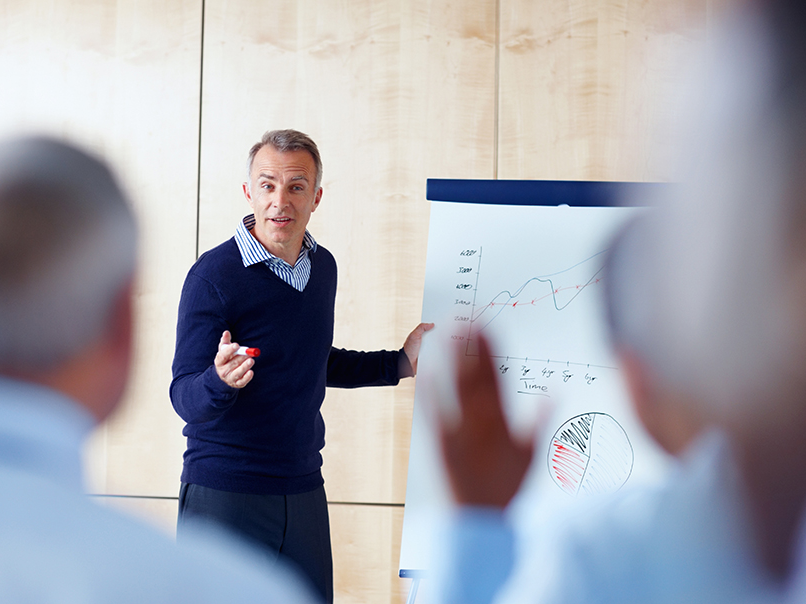 Trainer leading a risk management training session.