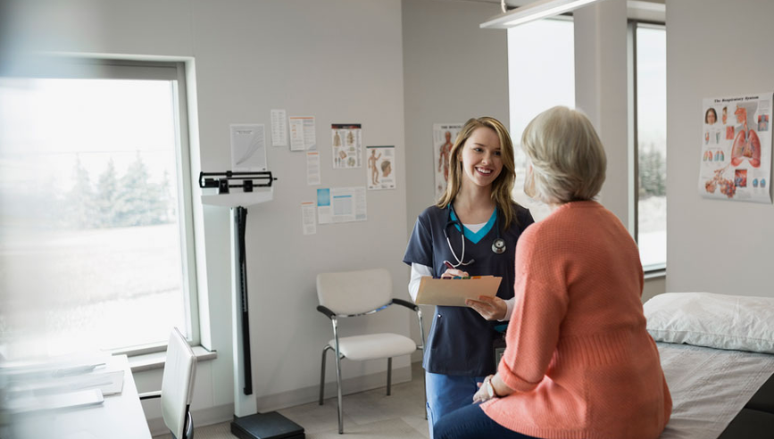 nurse speaking with a client