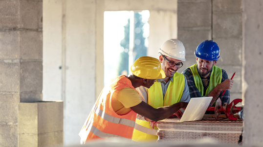 construction-workers-reviews-project-on-computer.jpg