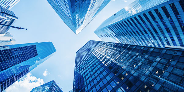 Image of skyscrapers looking towards the sky.