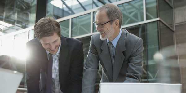 A real estate agent talking to a claim and risk agent.