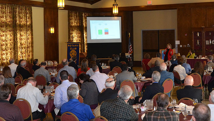 Joan Woodward addresses the Rotary Club of Austin before a screening of the nonpartisan deficit documentary Overdraft.