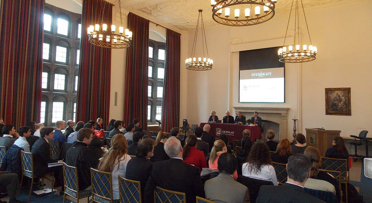 Students gather in a large room at Loyola University Chicago.