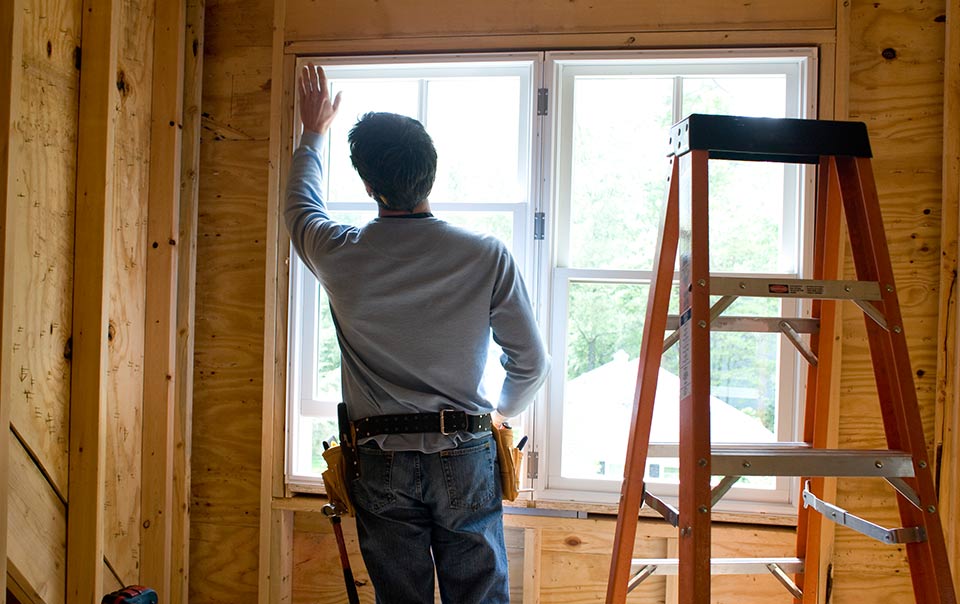 Contractor working on home window