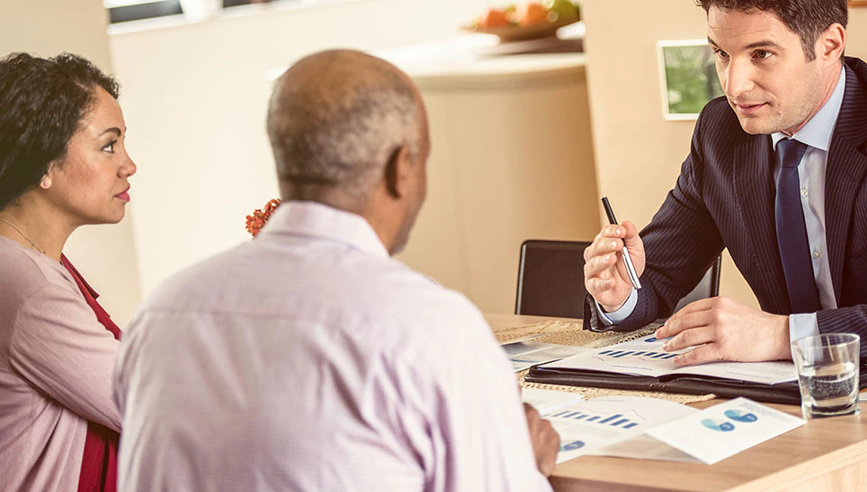 Couple meeting with car insurance agent.