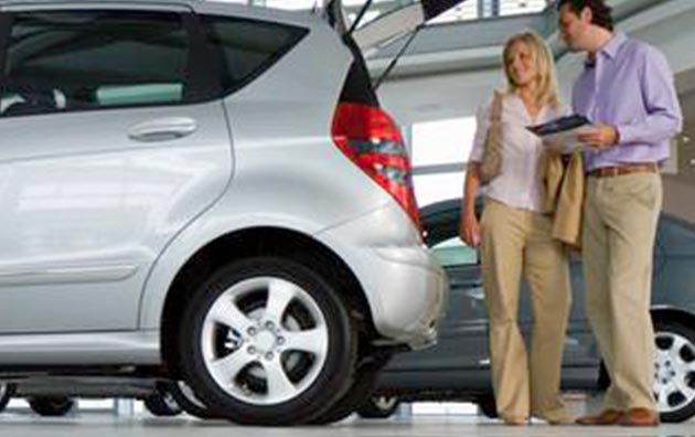 Couple shopping for a new car.