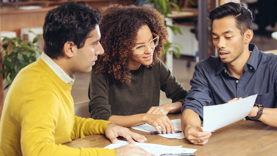 Young couple meeting insurance representative.