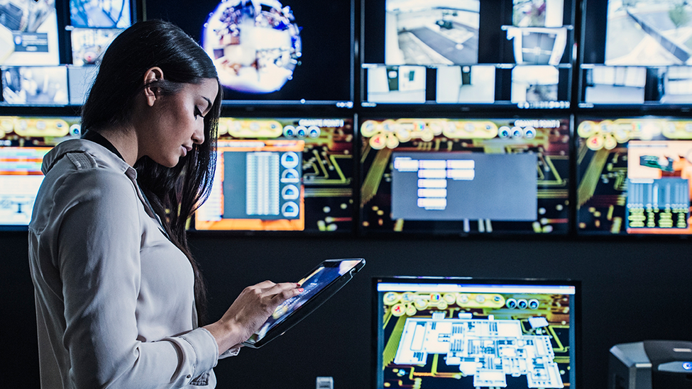 Woman in security monitor room