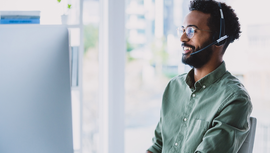 a call center agent assisting a customer, talking to them through a headset