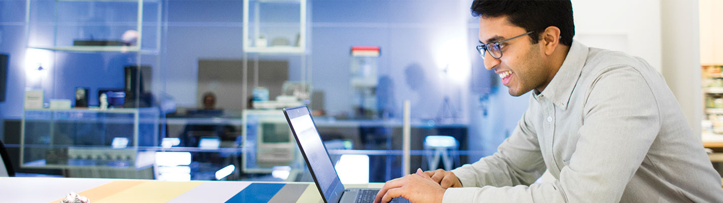 man working on computer in office