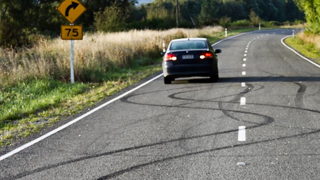 Car approaching a curve in the road.